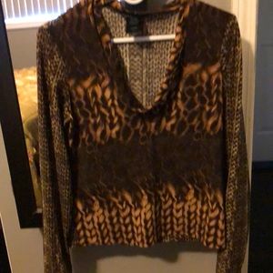 Gorgeous wrinkle free dressy top. I accidentally cut the sleeve while cutting.